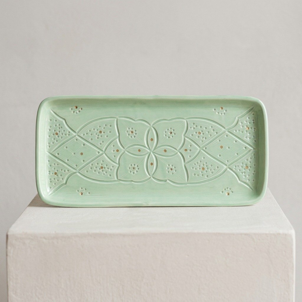Rectangular ceramic plate with carved relief pattern, light green – handmade by Rachid in Safi, Morocco